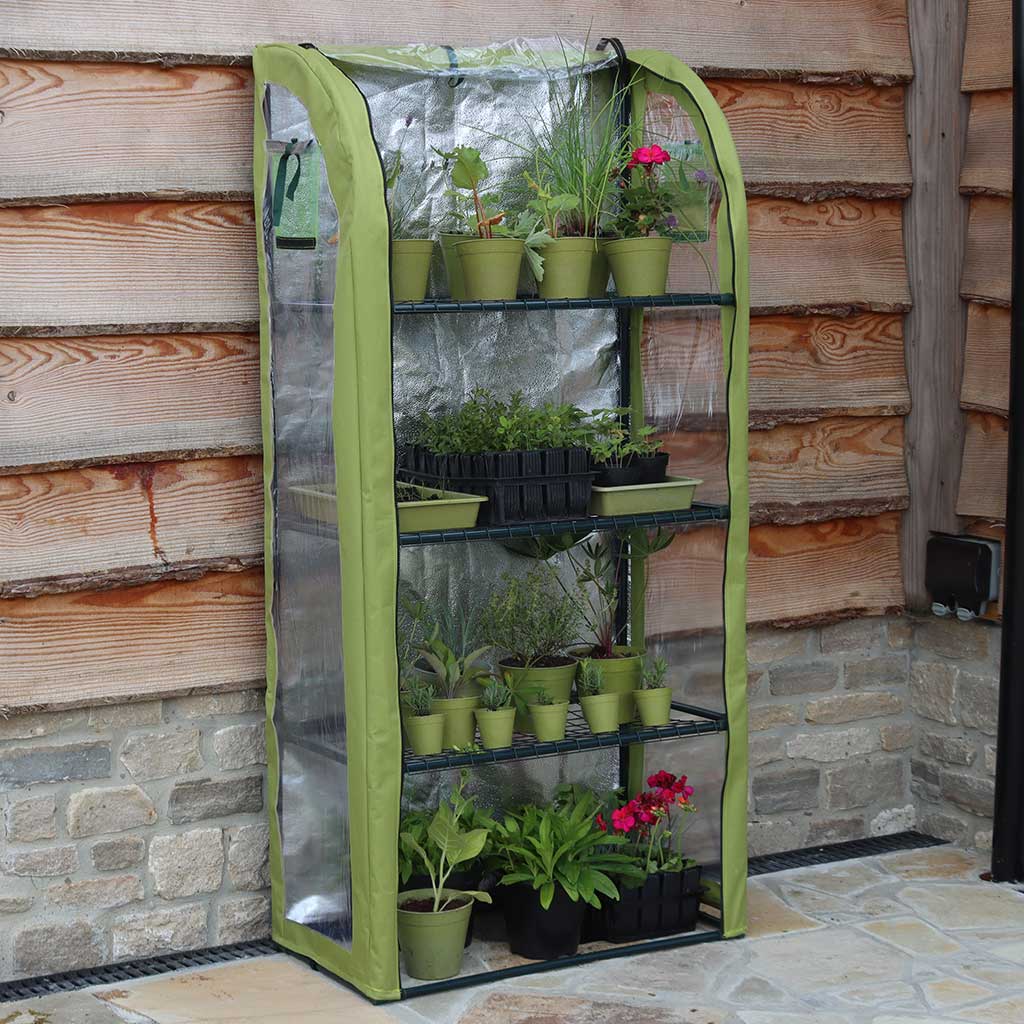 Lightbooster plant house growign plants on a patio